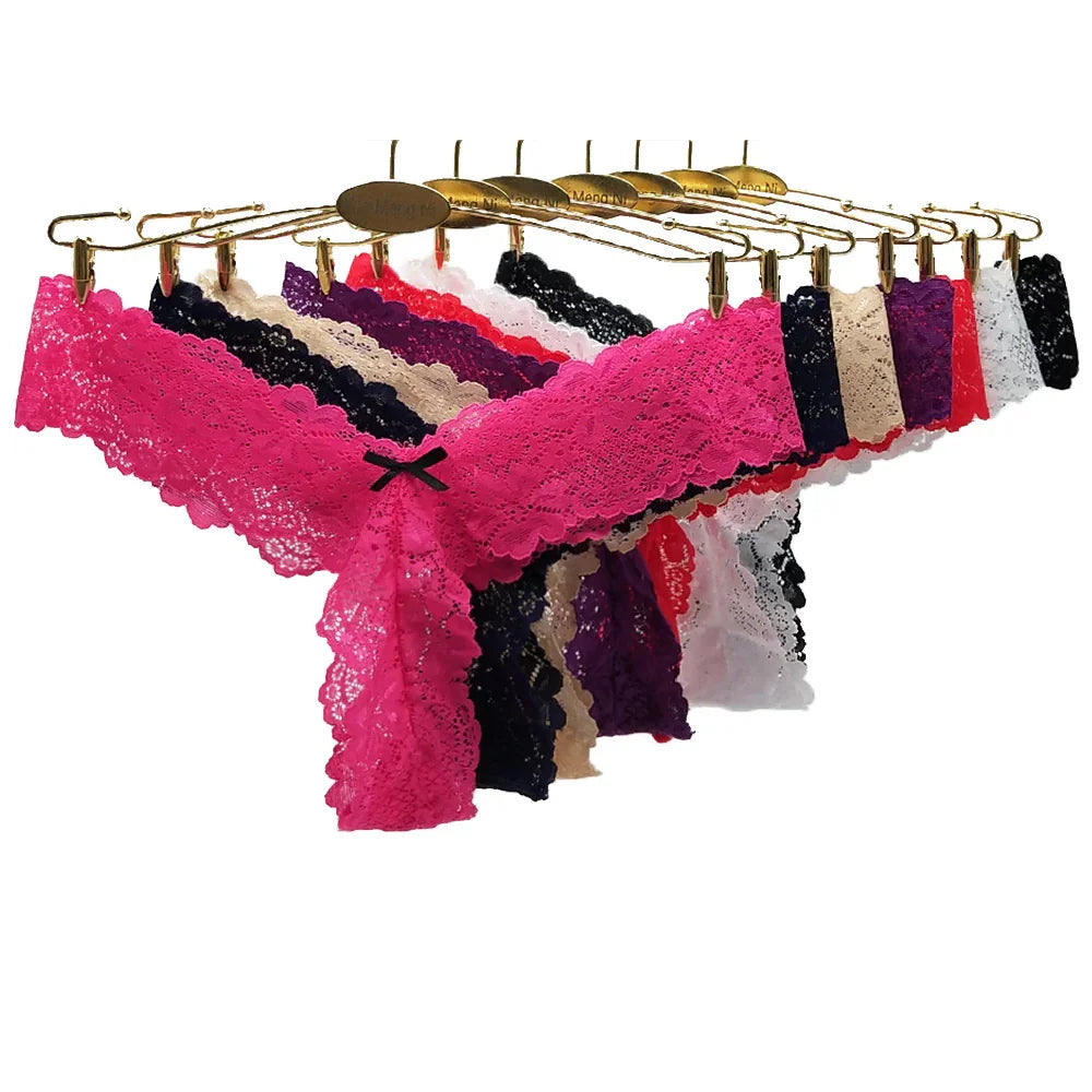Lace thong underwear in pink, black, red, purple, and beige on gold hangers, women's lingerie collection